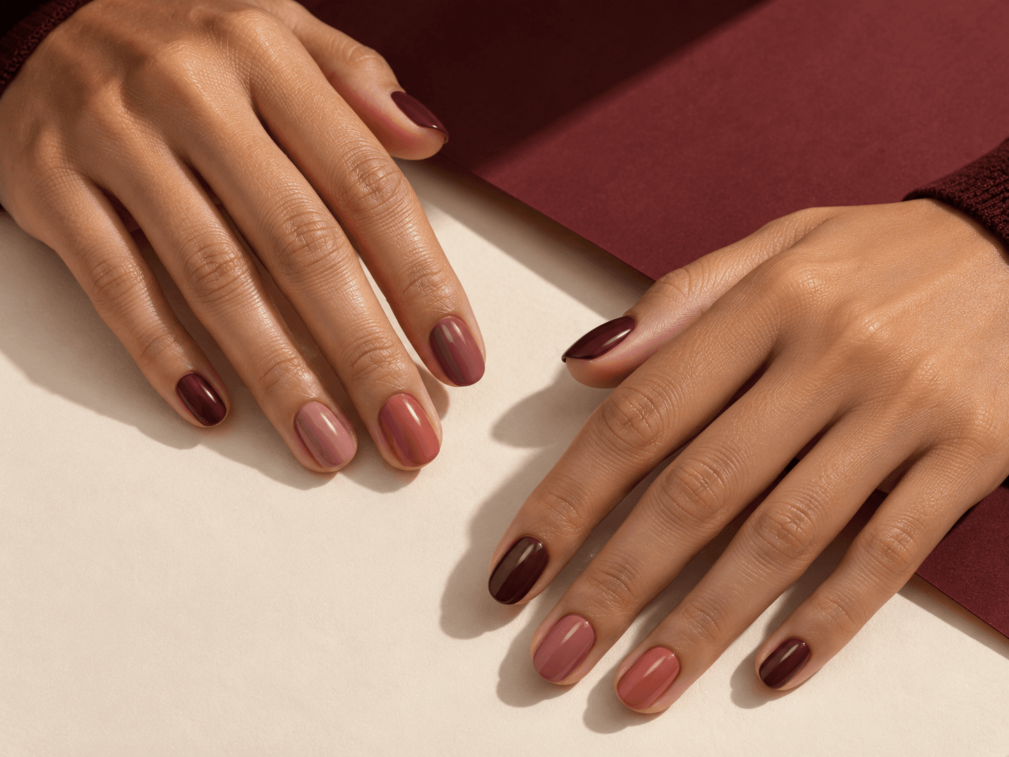 Detailed nail art in soft blush tones